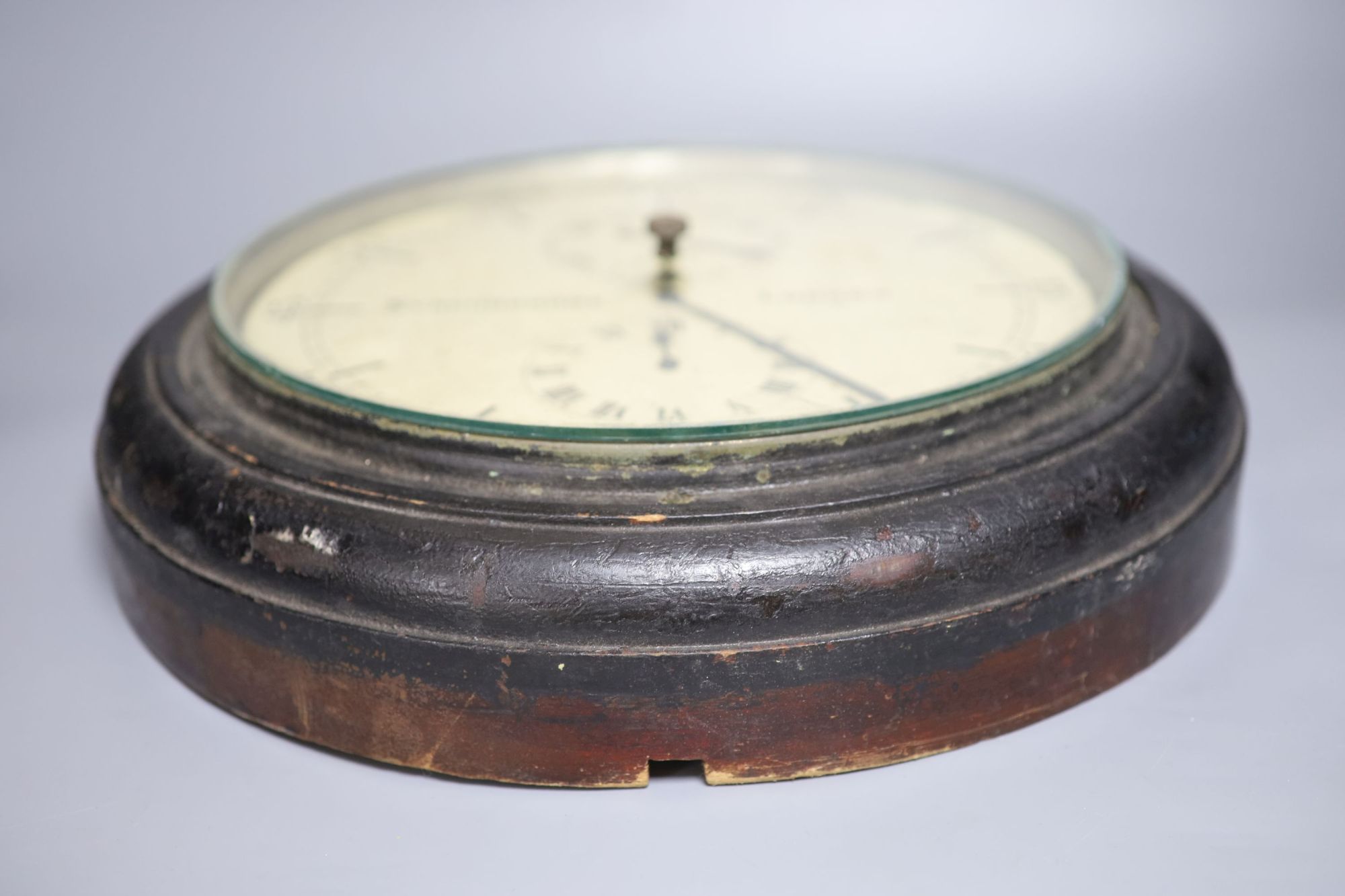 A Synchronome ebonised slave wall clock with two subsidiary dials,